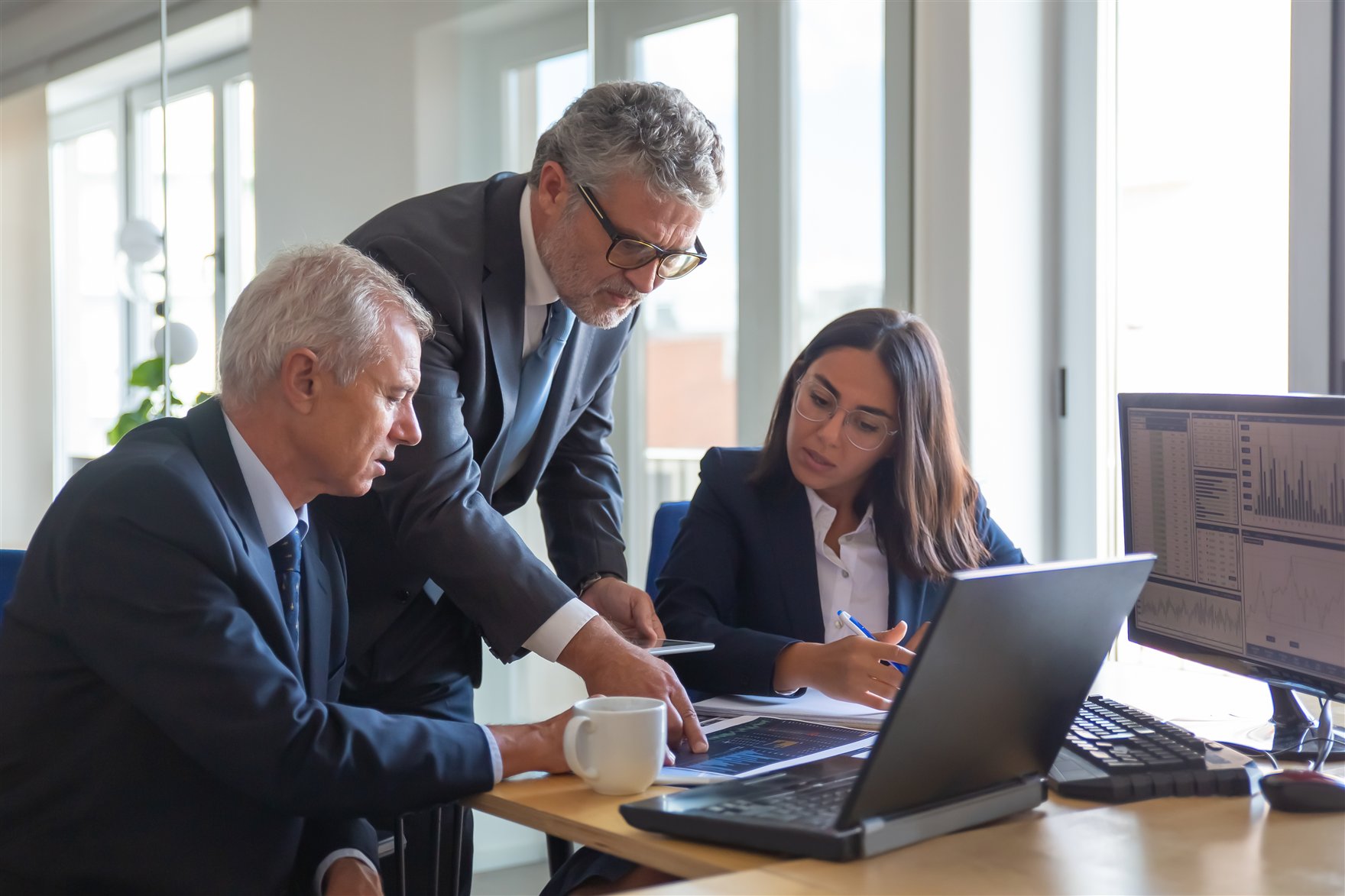 Specialists analyzing corporate indicators and processes